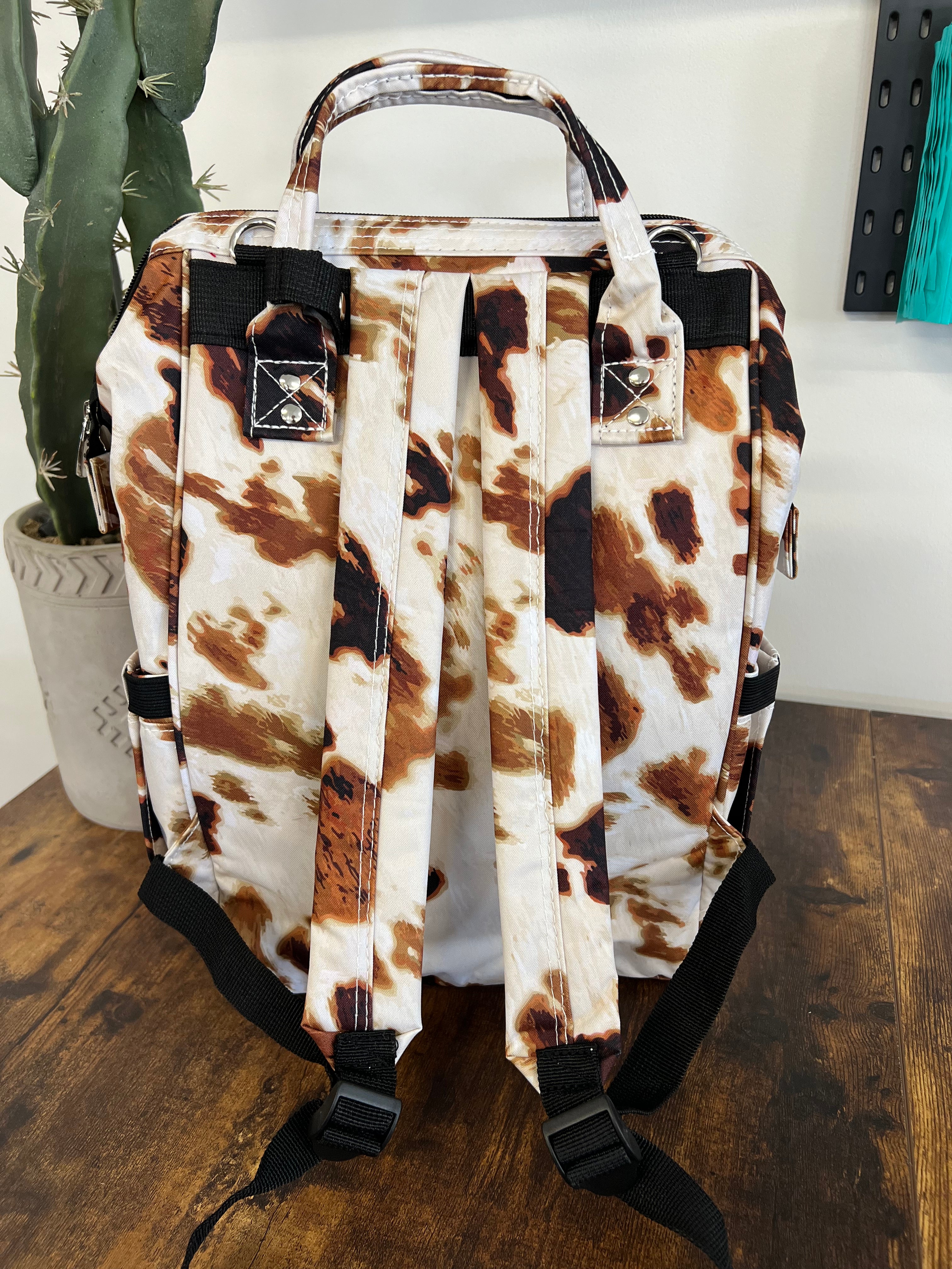 Cowhide best sale baby bag